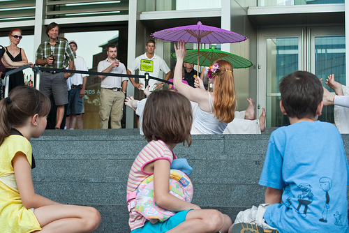 mall-performance Spectators look on at a shopping mall dance performance
