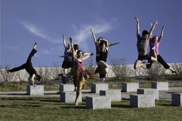 DanceAnywhere_press_0175 IMAGE A group of dancers jump into the air over concrete blocks. IMAGE