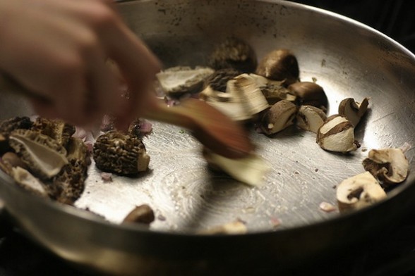 cooking-mushrooms IMAGE Mushrooms sautéed in a pan IMAGE
