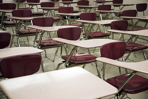 IMAGE Rows of empty desks for test-taking IMAGE
