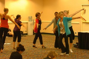 Beverly Spell leading teachers in a circle with ribbon rings at DTS 2010