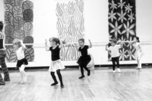 Black and white photo of children dancing