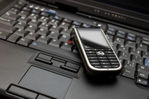 Photo of a phone on a computer keyboard