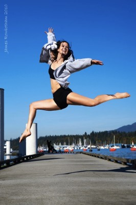 IMAGE Dancer Ashley Whitehead leaping on the docks of Coal Harbour, Vancouver, B.C. on a sunny day. IMAGE