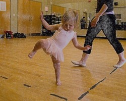 IMAGE A toddler balances on one foot in her creative dance class. IMAGE