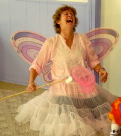 IMAGE Alexandra of Hullabaloo Danceshop looks jovial in butterfly wings as she waves a magic wand over her creative dance class. IMAGE