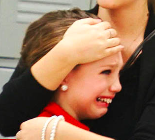 IMAGE A young dancer sheds tears during an episode of Dance Moms IMAGE