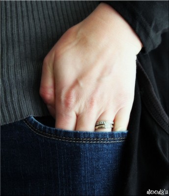 IMAGE A woman's hand slips into her pocket IMAGE