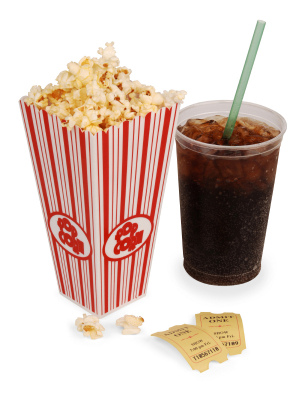 IMAGE A box of popcorn, soda, and two tickets IMAGE