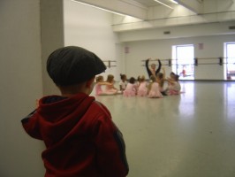 IMAGE A little boy watches his sister's dance class IMAGE