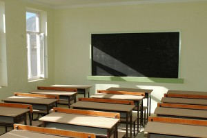 IMAGE An empty classroom with desks and a chalkboard IMAGE