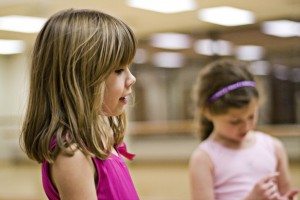 IMAGE Two young dancers wearing pink in ballet class IMAGE